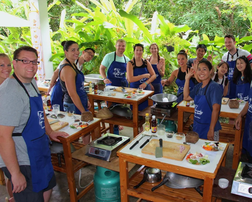 Travelers cooking at Thai Secret Cooking School in Chiang Mai